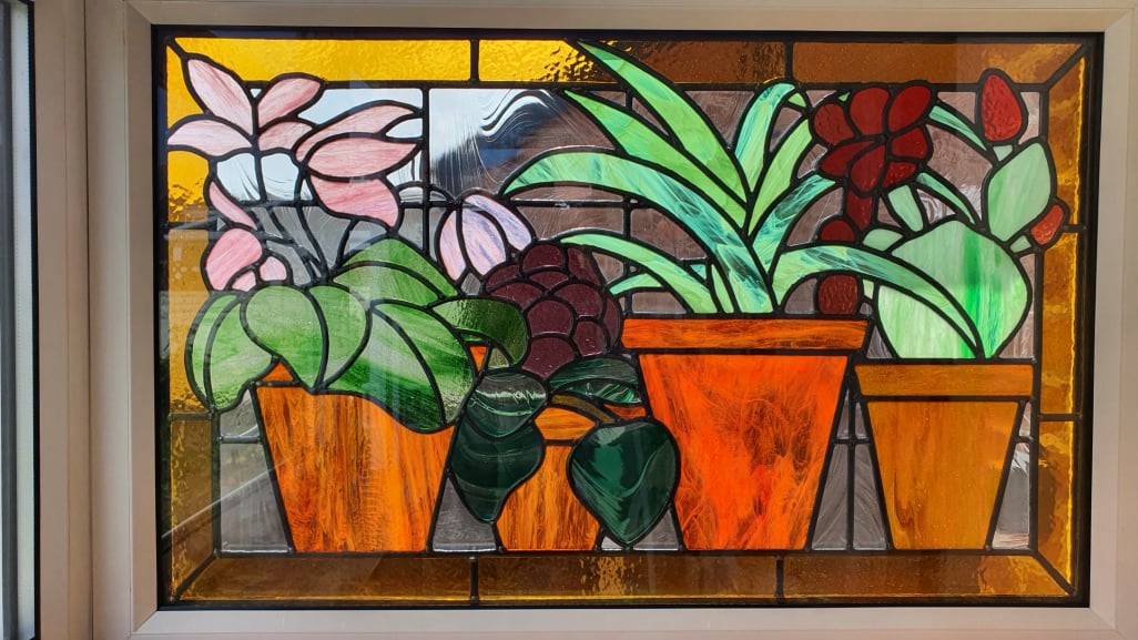 Encapsulated stain glass double glazing unit