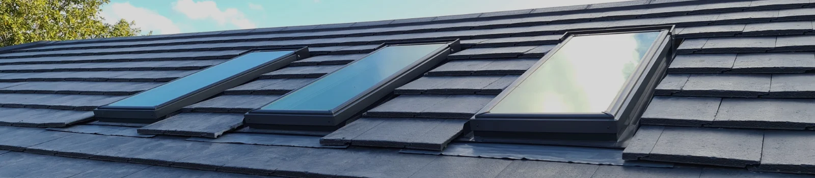Velux windows in a modern grey tiled roof, Velus glass replacement Fylde